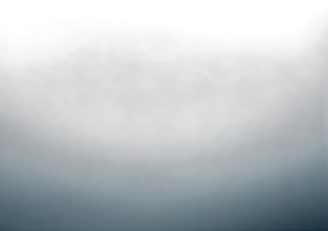 Misty blue mountain ridgeline fading into cloud, viewed from above.
